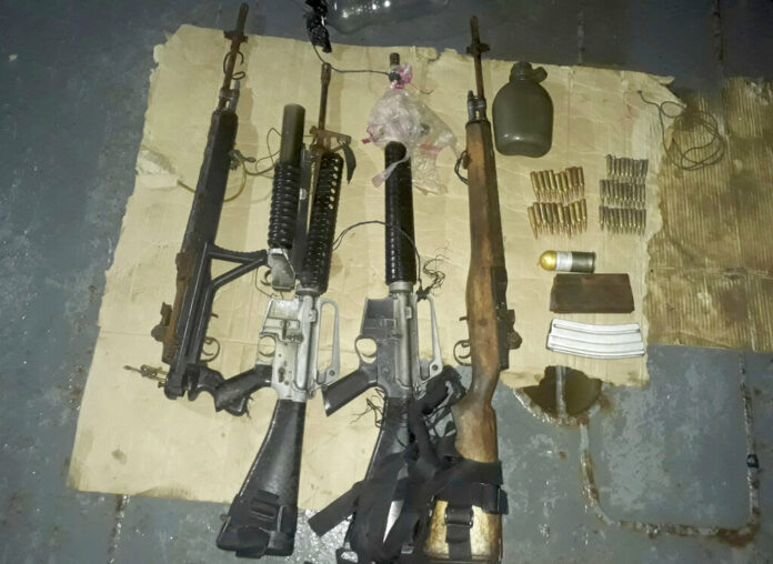 Philippines Hostages Escape This photo provided by WESMINCOM Armed Forces of the Philippines Sunday, April 7, 2019, shows recovered firearms from Muslim extremist Abu Sayyaf kidnappers following a rescue operation that freed Indonesian hostage Heri Ardiansyah and two others off Simisa island, Sulu province in southern Philippines. Photo: WESMINCOM Armed Forces of the Philippines via AP
