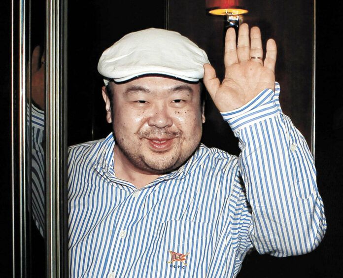 In this June 4, 2010, file photo, Kim Jong Nam, the eldest son of then North Korean leader Kim Jong Il, waves after his first-ever interview with South Korean media in Macau. Photo: Shin In-seop / JoongAng Ilbo via AP