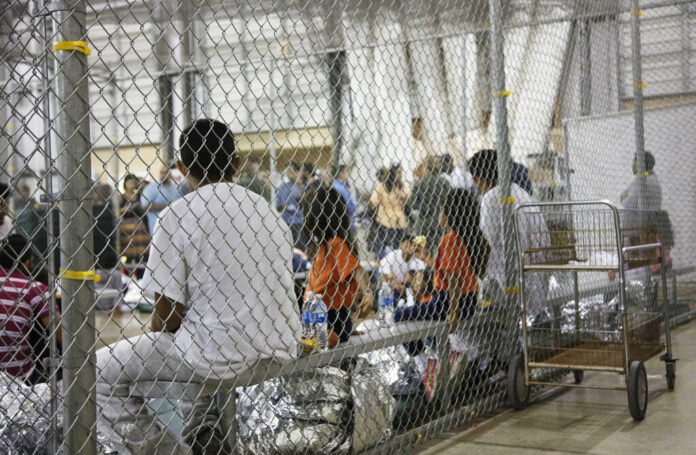 In this June 17, 2018 file photo provided by U.S. Customs and Border Protection, people who've been taken into custody related to cases of illegal entry into the United States, sit in one of the cages at a facility in McAllen, Texas. Photo: U.S. Customs and Border Protection's Rio Grande Valley Sector via AP