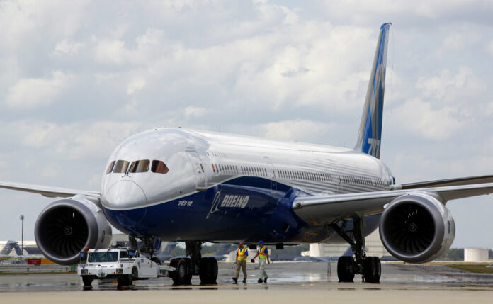Singapore Boeing In this March 31, 2017, file photo, Boeing employees walk the new Boeing 787-10 Dreamliner down towards the delivery ramp area at the company's facility in South Carolina after conducting its first test flight at Charleston International Airport in North Charleston, S.C. Photo: Mic Smith / Associated Press