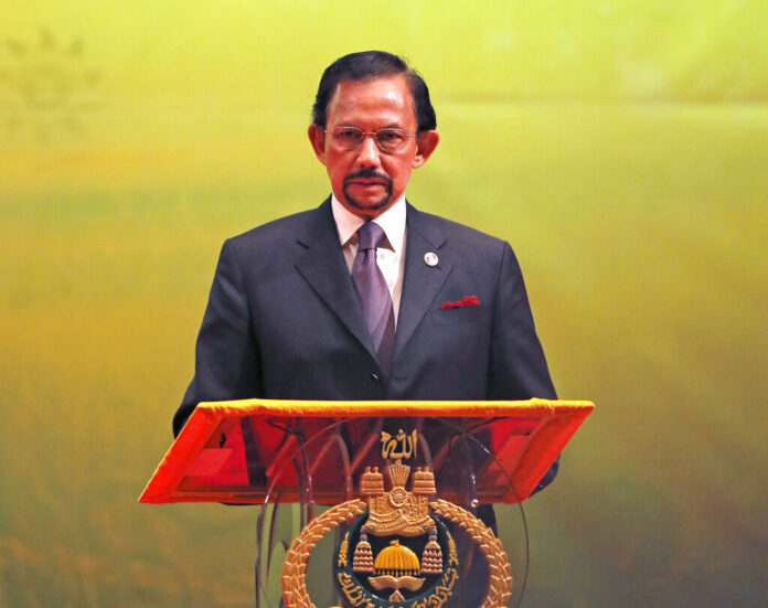 In this Oct, 10, 2013, photo, Brunei's Sultan Hassanal Bolkiah speaks during the closing ceremony and handover of the ASEAN Chairmanship to Myanmar in Bandar Seri Begawan. Photo: Vincent Thian / Associated Press