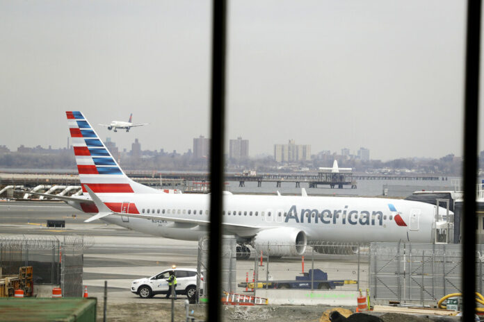 In a March 13, 2019 file photo, an American Airlines Boeing 737 MAX 8 sits at a boarding gate at LaGuardia Airport in New York. Photo: Frank Franklin II / Associated Press