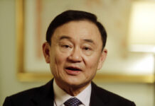 King Strips Ex-PM Thaksin of Paramilitary Rank In this March 9, 2016, file photo, Thailand's former Prime Minister Thaksin Shinawatra responds to questions during an interview in New York. Photo: Frank Franklin II / Associated Press