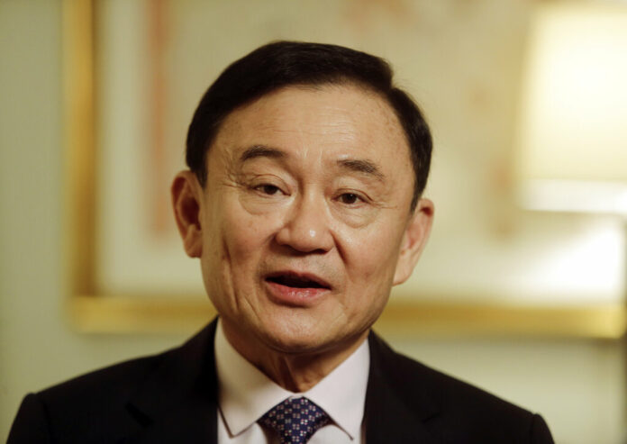 In this March 9, 2016, file photo, Thailand's former Prime Minister Thaksin Shinawatra responds to questions during an interview in New York. Photo: Frank Franklin II / Associated Press