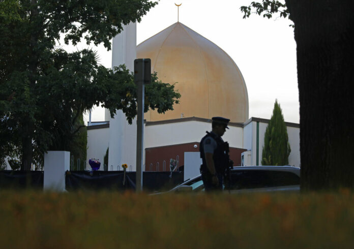 In this March 17, 2019, file photo, a police officer stands guard in front of the Al Noor mosque in Christchurch, New Zealand. Photo: Vincent Yu / Associated Press