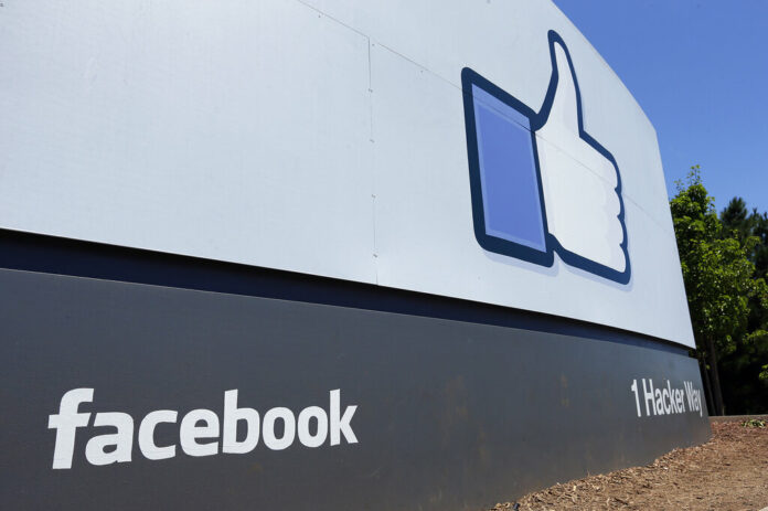 This July 16, 2013 file photo shows a sign at Facebook headquarters in Menlo Park, Calif. Photo: Ben Margot / Associated Press