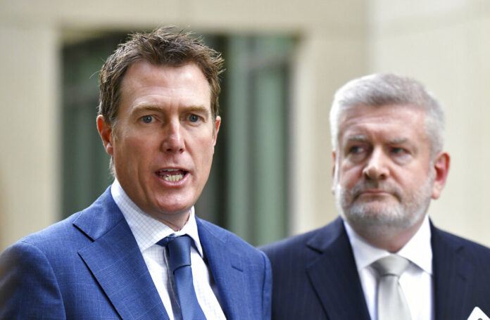Australia Social Media Australia's Attorney-General Christian Porter, left, and Minister for Communications Mitch Fifield hold a press conference at Parliament House, in Canberra, Wednesday, April 4, 2019. Photo: Mick Tsikas / AAP Image via AP