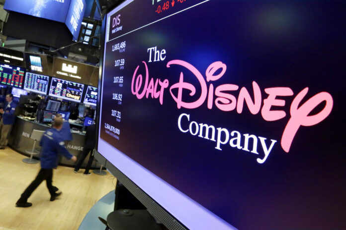 In this Aug. 8, 2017, file photo, The Walt Disney Co. logo appears on a screen above the floor of the New York Stock Exchange. Photo: Richard Drew / Associated Press