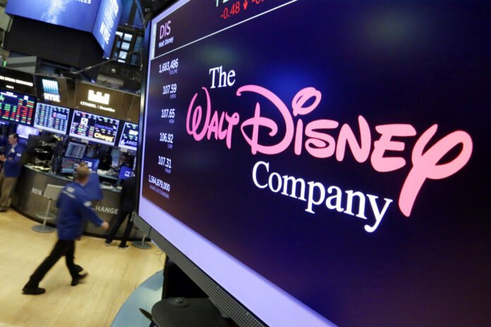 The Walt Disney Company In this Aug. 8, 2017, file photo, The Walt Disney Co. logo appears on a screen above the floor of the New York Stock Exchange. Photo: Richard Drew / Associated Press