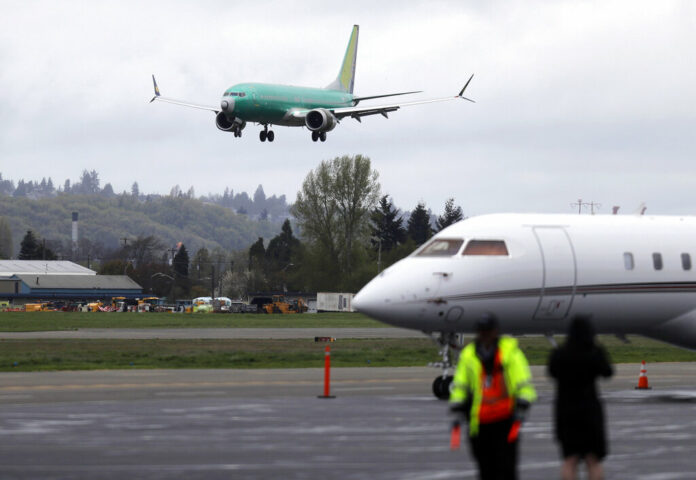 Boeing Grounded Planes A Boeing 737 MAX 8 airplane being built for India-based Jet Airways, top, lands following a test flight, Wednesday, April 10, 2019, at Boeing Field in Seattle. Photo: Ted S. Warren / Associated Press