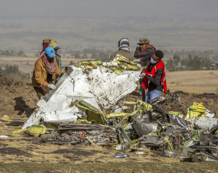 In this March 11, 2019, file photo, rescuers work at the scene of an Ethiopian Airlines flight crash near Bishoftu, Ethiopia. Photo: Mulugeta Ayene / Associated Press