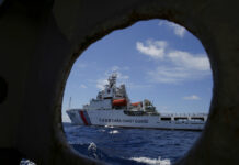 Philippines Issues Strongly Worded Rebuke at China Flotillas In this photo taken March 29, 2014, a Chinese Coast Guard ship attempts to block a Philippine government vessel as the latter tries to enter Second Thomas Shoal to relieve Philippine troops and resupply provisions. Photo: Bullit Marquez / Associated Press