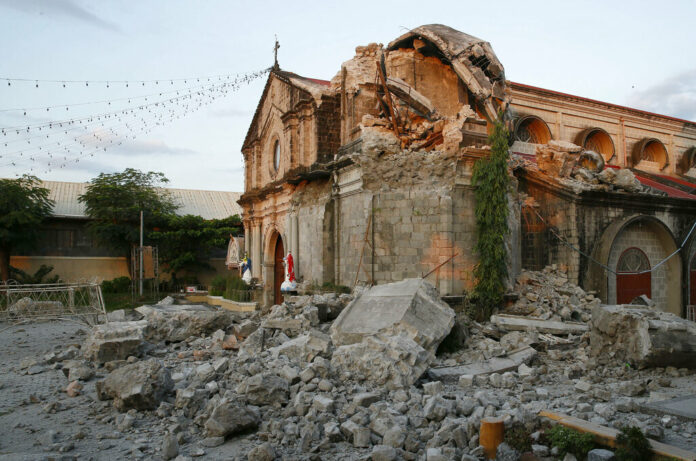 Damaged St. Catherine church is seen Tuesday following a 6.1 magnitude earthquake that also caused the collapse of a commercial building in Porac township, Pampanga province, north of Manila, Philippines. Photo: Bullit Marquez / Associated Press