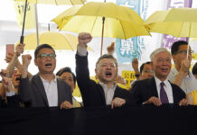 Leaders of Hong Kong Pro-Democracy Protests Get Jail Terms Occupy Central leaders, from left, Chan Kin-man, Benny Tai and Chu Yiu-ming chant slogans before entering a court in Hong Kong, Wednesday, April 24, 2019. Photo: Kin Cheung / Associated Press