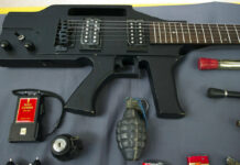 TSA’s Social Media Highlight Weird Stuff in Travelers’ Bags Items, prohibited on passenger airlines, and confiscated from passengers by Transportation Security Administration (TSA) officers, is displayed at Dulles International Airport in Dulles, Va., Tuesday, March 26, 2019. The items include a guitar shaped like a semi-automatic rifle, an inert grenade, and a stun gun. Photo: Cliff Owen / Associated Press