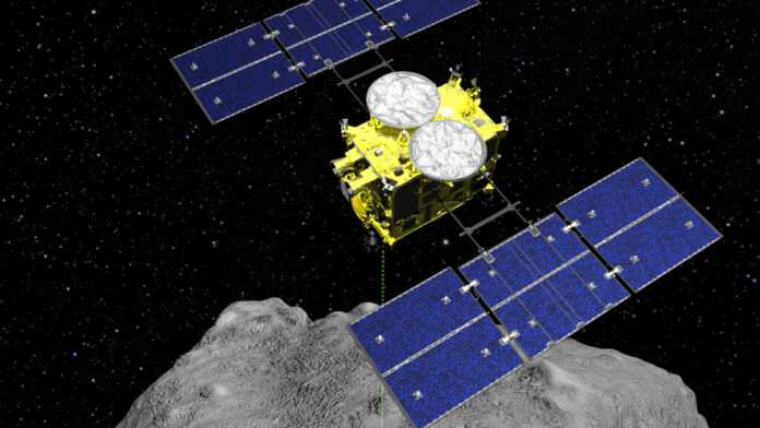 Japan Asteroid Probe In this computer graphics image released by the Japan Aerospace Exploration Agency (JAXA), the Hayabusa2 spacecraft is seen above on the asteroid Ryugu. Photo: ISAS / JAXA via AP