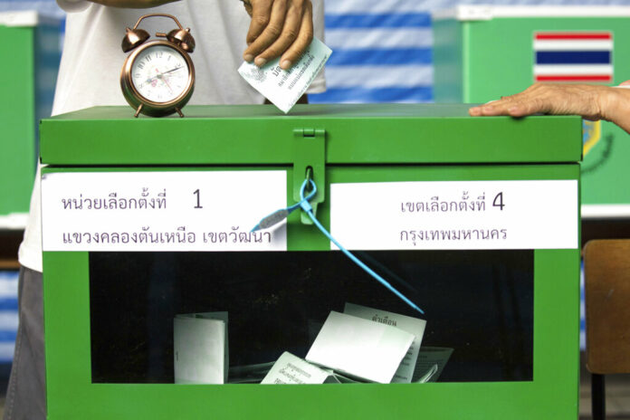 APTOPIX Thailand Election A woman casts her vote at a polling station March 24 in Bangkok, during Thailand's first general election since the military seized power in a 2014 coup. Photo: Wason Wanichakorn / Associated Press