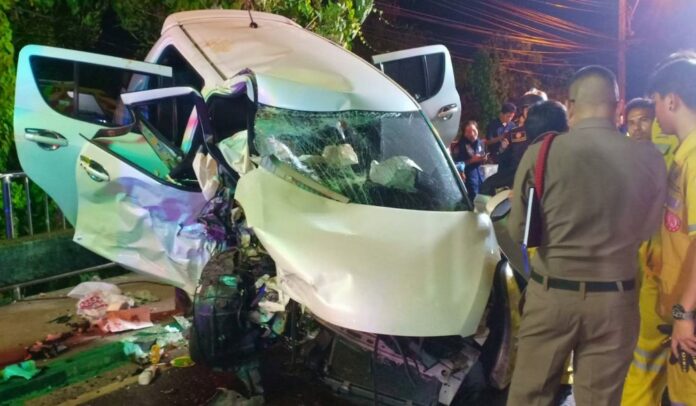 Police and rescue workers stand at the scene of car crash Thursday night that killed a policeman and his wife in Bangkok. Police and rescue workers stand at the scene of car crash Thursday night that killed a policeman and his wife in Bangkok.