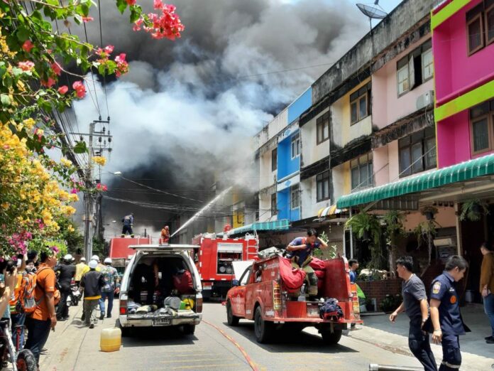 Firefighters at a factory in Bangkok Wednesday where a huge fire broke out. Firefighters at a factory in Bangkok Wednesday where a huge fire broke out.