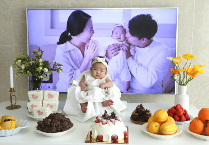 In this April 9, 2019, photo, Lee Dong Kil's daughter Lee Yoon Seol sits to celebrate her the 100th day of the birth at Lee's house in Daejeon, South Korea. Photo: Ahn Young-joon / Associated Press