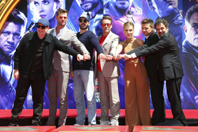 Marvel Studios President Kevin Feige, from left, poses with members of the cast of 