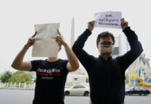 Freedom House Rates Thailand as “Not Free” Lawyer and activist Arnon Nampa, right, leads a protest against the Election Commission April 7, 2019 at Bangkok’s Victory Monument. Photo: Thai Lawyers for Human Rights / Twitter