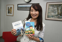 70s HK Pop Singer ‘Agnes Chan’ Looks Back on Stardom, Talks Motherhood Agnes Chan holds up Thai versions of her books.