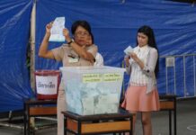 Ballot Recounts, By-Elections Ordered in Some Polling Stations An official counts a ballot on March 24 at a polling station in Bangkok’s Phra Khanong district.