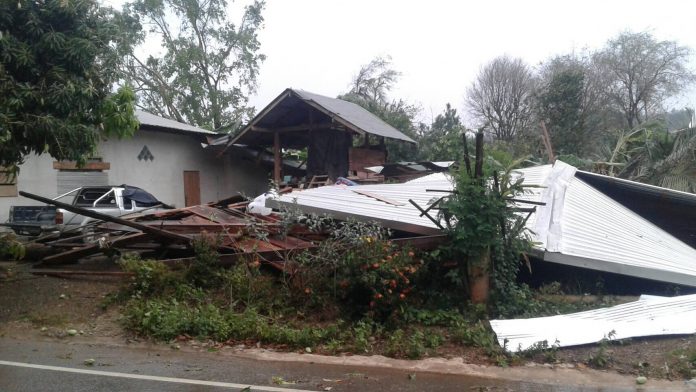 A house in the northern province of Nan is seen collapsed to the ground on Tuesday following a powerful storm. A house in the northern province of Nan is seen collapsed to the ground on Tuesday following a powerful storm.
