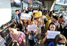 Prayuth Pleads for Order as Distrust of Election Commission Grows Protesters hold signs during a demonstration Sunday in Bangkok demanding the Election Commission be impeached.