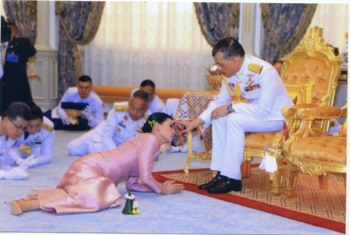 Queen Suthida and His Majesty the King in a wedding ceremony in footage released by the palace Wednesday night.