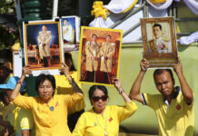 As Coronation Begins, Thai King’s Future Plans Still Unclear Thai well-wishers hold portrait of Thailand's King Maha Vajiralongkorn outside Grand Palace in Bangkok, Thailand, Saturday, May 4, 2019. Photo: Sakchai Lalit / AP