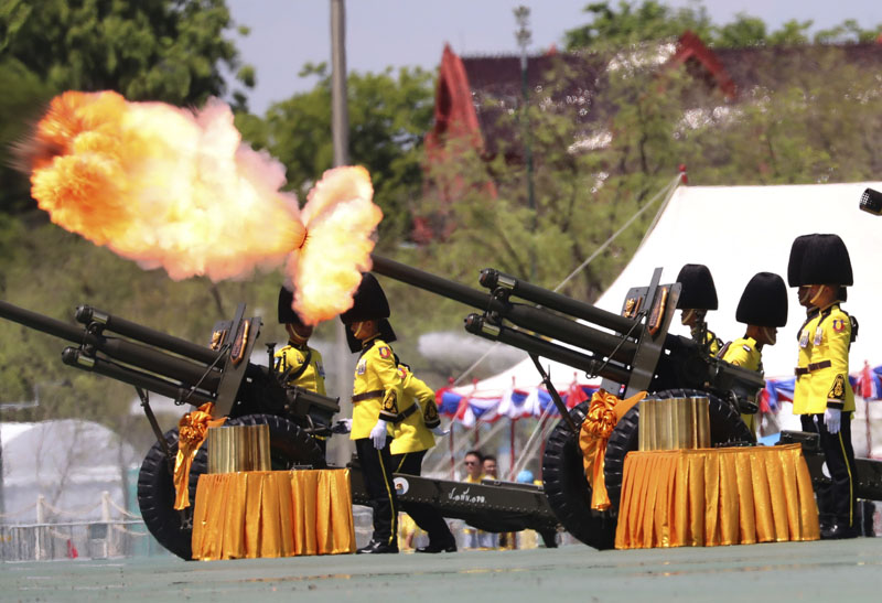 Royal Guards fire cannons in honour of Thailand's King Maha Vajiralongkorn Saturday, May 4, 2019, in Bangkok, Thailand. Saturday began three days of elaborate centuries-old ceremonies for the formal coronation of Vajiralongkorn, who has been on the throne for more than two years following the death of his father, King Bhumibol Adulyadej, who died in October 2016 after seven decades on the throne. Photo: Sakchai Lalit / AP