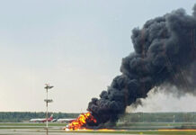 Russia Says at Least 40 Dead on Burning Jet In this image provided by Riccardo Dalla Francesca shows smoke rises from a fire on a plane at Moscow's Sheremetyevo airport on Sunday, May 5, 2019. Photo: Riccardo Dalla Francesca / AP