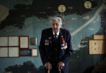D-Day Still Takes an Emotional Toll on Vets, 75 Years On British D-Day veteran Leonard 'Ted' Emmings, who was a naval Coxswain serving on a small landing craft which landed 36 Canadians on Juno beach in France, poses for photographs backdropped by the map used to plan the Normandy D-Day landings at Southwick House near Portsmouth, England, May 9, 2019. Southwick House was the forward headquarters of the allied forces preparing for the invasion of Normandy in 1944, the nerve center of D-Day. Photo: Matt Dunham
