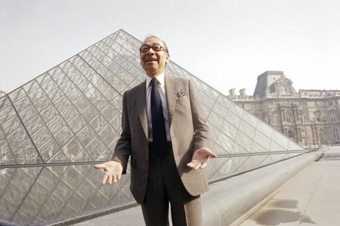 In this March 29, 1989, file photo, Chinese-American architect I.M. Pei laughs while posing for a portrait in front of the Louvre glass pyramid, which he designed, in the museum's Napoleon Courtyard, prior to its inauguration in Paris. Pei, the globe-trotting architect who revived the Louvre museum in Paris with a giant glass pyramid and captured the spirit of rebellion at the multi-shaped Rock and Roll Hall of Fame, has died at age 102, a spokesman confirmed Thursday, May 16, 2019. Photo: Pierre Gleizes / AP