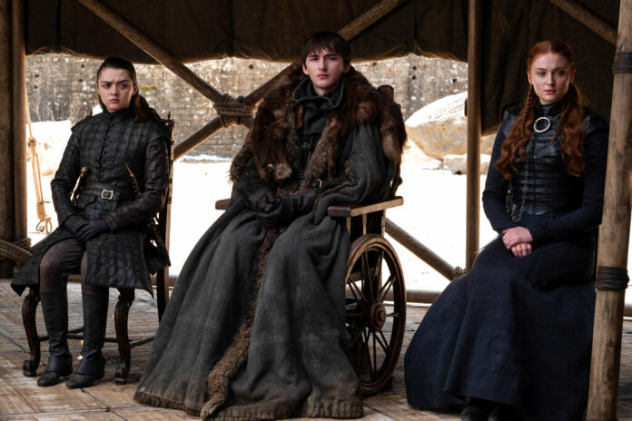 This image released by HBO shows from left to right Maisie Williams, Isaac Hempstead Wright and Sophie Turner in a scene from the final episode of 
