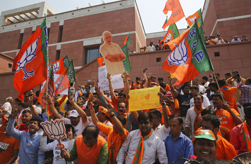 Bharatiya Janata Party (BJP) supporters celebrate their party's victory in the general elections in New Delhi, India, Thursday, May 23, 2019. Indian Prime Minister Narendra Modi's party claimed it had won reelection with a commanding lead in Thursday's vote count, while the stock market soared in anticipation of another five-year term for the pro-business Hindu nationalist leader. Photo: Manish Swarup