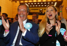 Brexit Party Wins, Conservatives Bashed in UK’s EU Voting Brexit Party leader Nigel Farage, left, reacts as results are announced at the counting center for the European Elections for the South East England region, in Southampton, England, Sunday, May 26, 2019. Photo: Alastair Grant / AP