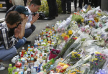 Deadly Knife Attack on Schoolgirls Startles Japan People pray for victims at the site where a knife attack took place in Kawasaki near Tokyo Wednesday, May 29, 2019. Photo: Koji Sasahara / AP