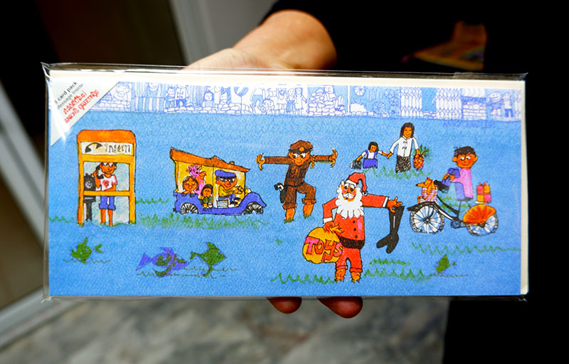 A card showing Santa Claus braving the Thai flooding season.
