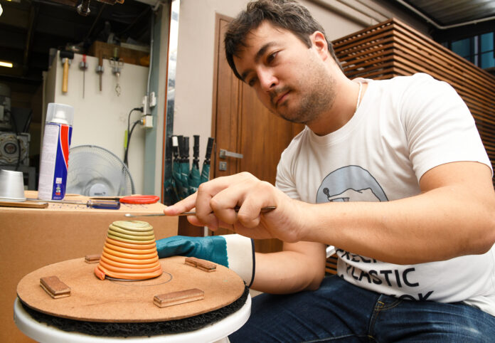 Dominic Puwasawat Chakrabongse, director of Precious Plastic Bangkok, makes a plant pot.