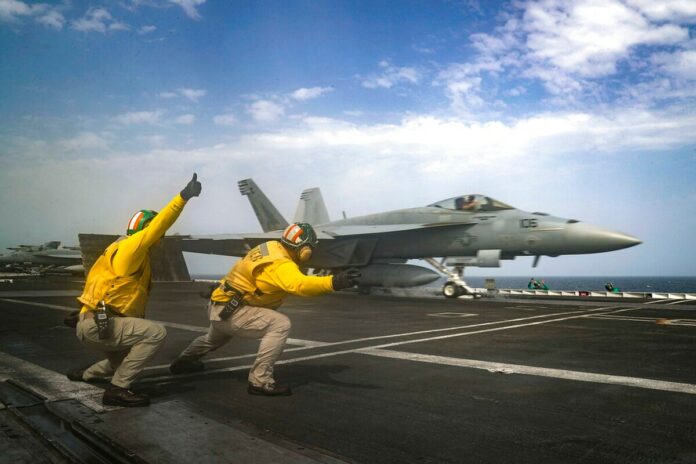 The flight deck of the aircraft carrier Thursday, when the warship was sailing the Arabian Sea. (Mass Communications 3rd Class Jeff Sherman/Navy via AP)
