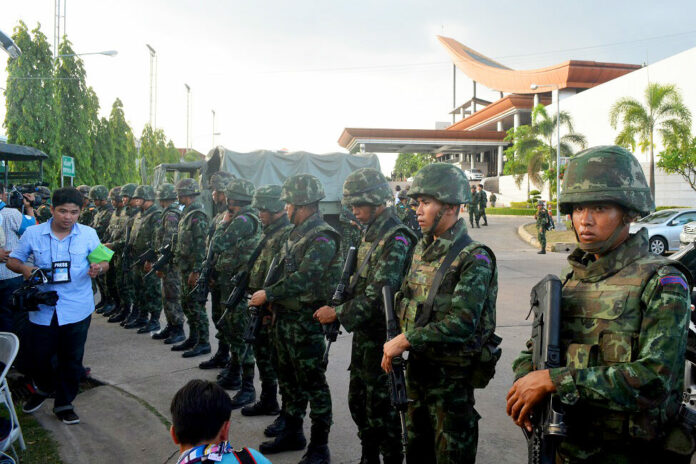 Soldiers face off with reporters moments after the military stages a coup on May 22, 2014.