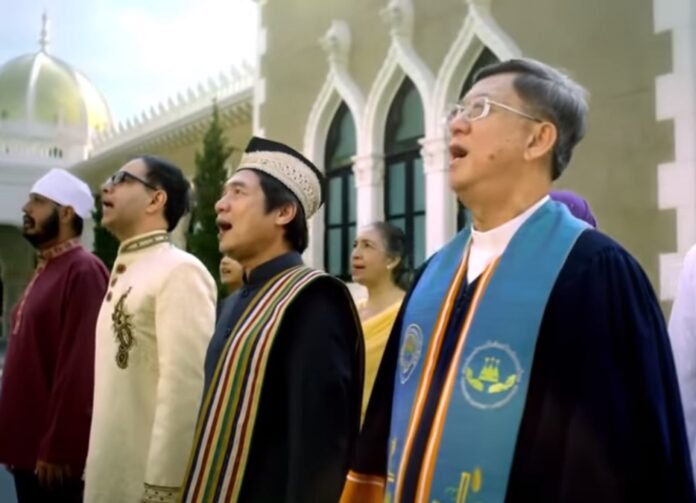 Representatives of different religions sing the national anthem together in the government’s official music video.