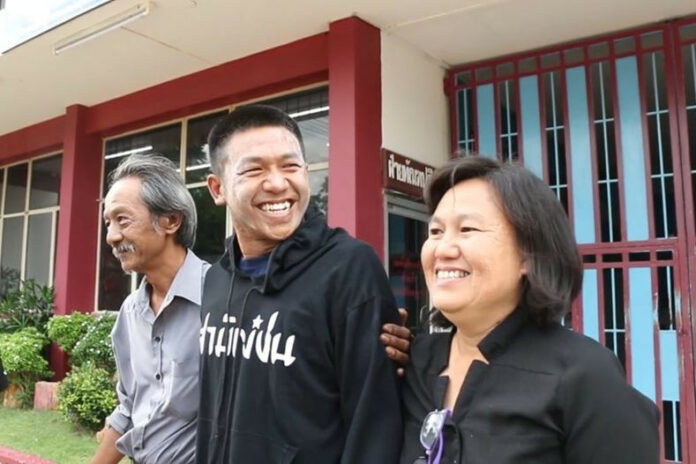 A file photo of Jatupat 'Pai' Boonpattararaksa with his parents.