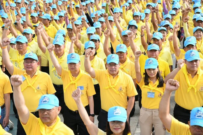 Leaders of the pro-junta Phalang Pracharath Party join a volunteer group on May 9, 2019, to clean streets in Bangkok