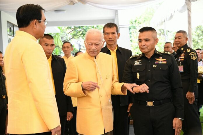 Gen. Prem Tinsulanonda chats with junta chairman Prayuth Chan-ocha at his residence in Bangkok on April 11, 2019.