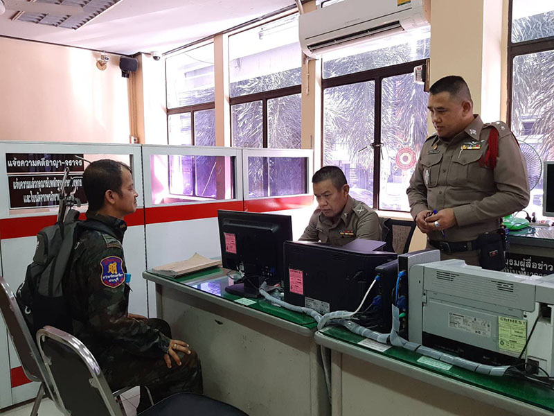 Somkiat Khunsaen, left with Police Capt. Pattarapol Pintong, right. 