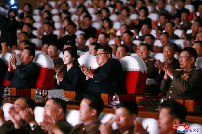 In this June 2, 2019, photo provided on Monday, June 3, 2019, by the North Korean government, North Korean leader Kim Jong Un, center right, and his wife Ri Sol Ju, center left, clap hands in a musical performance by the wives of Korean People's Army officers in North Korea. Photo: Korean Central News Agency / Korea News Service via AP